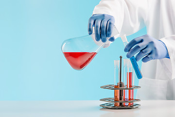 Image showing Experiments in a chemistry lab. conducting an experiment in the laboratory.