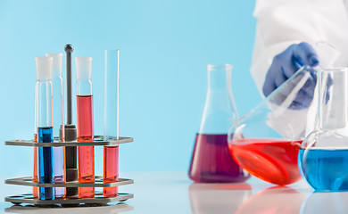 Image showing Experiments in a chemistry lab. conducting an experiment in the laboratory.