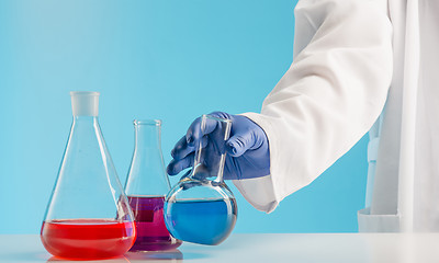 Image showing Experiments in a chemistry lab. conducting an experiment in the laboratory.