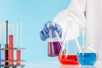 Image showing Experiments in a chemistry lab. conducting an experiment in the laboratory.