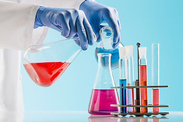 Image showing Experiments in a chemistry lab. conducting an experiment in the laboratory.