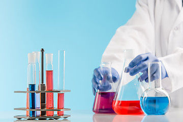 Image showing Experiments in a chemistry lab. conducting an experiment in the laboratory.