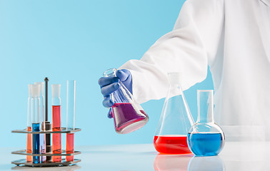 Image showing Experiments in a chemistry lab. conducting an experiment in the laboratory.