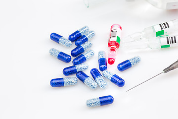 Image showing Blue capsules and pills background