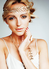 Image showing young blond woman dressed like ancient greek godess, gold jewelry close up isolated, beautiful girl hands manicured red nails