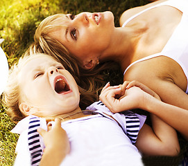 Image showing mother with daughter having fun on grass