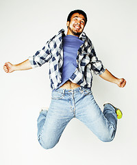 Image showing young pretty asian man jumping cheerful against white background