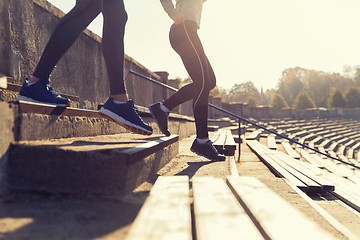 Image showing close up of couple running downstairs on stadium