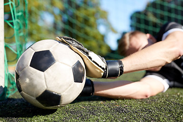 Image showing goalkeeper with ball at football goal on field