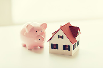 Image showing close up of house model and piggy bank