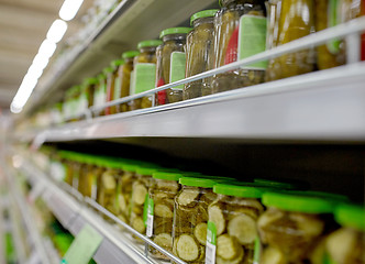 Image showing jars of pickles on grocery or supermarket shelves