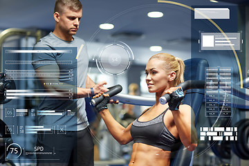 Image showing man and woman flexing muscles on gym machine