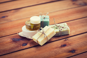 Image showing close up of handmade soap bars on wood