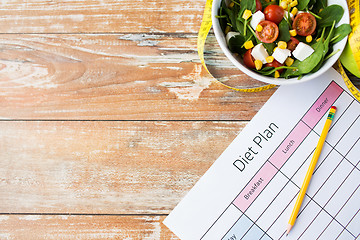 Image showing close up of diet plan and food on table