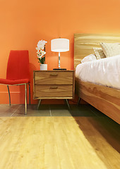 Image showing Bright bedroom in orange tones