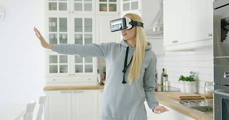 Image showing Woman enjoying VR headset