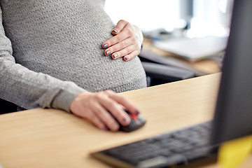 Image showing pregnant businesswoman with computer at office