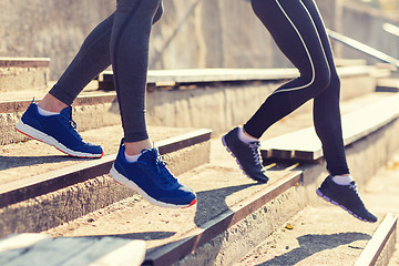 Image showing close up of couple running downstairs on stadium