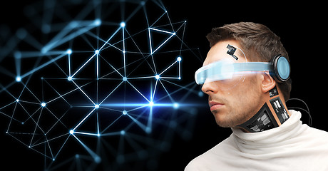 Image showing man in virtual reality glasses and microchip