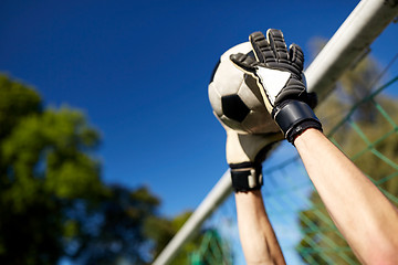 Image showing goalkeeper with ball at football goal on field