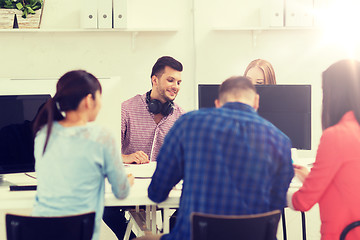 Image showing happy creative team or students working at office