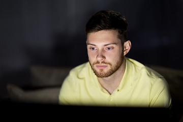 Image showing young man watching tv at night