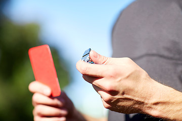 Image showing referee with whistle and red card at soccer game