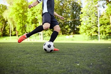 Image showing soccer player playing with ball on field