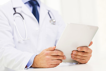 Image showing male doctor in white coat with tablet pc