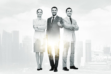 Image showing group of smiling businessmen showing thumbs up