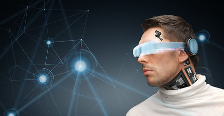 Image showing man in virtual reality glasses and microchip