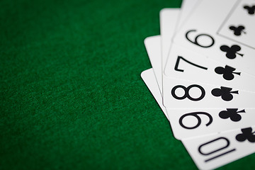 Image showing poker hand of playing cards on green casino cloth