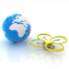 Image showing Quadrocopter Drone with Earth Globe and remote controller on a w