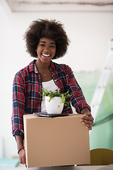 Image showing Black girl moving in the new apartment