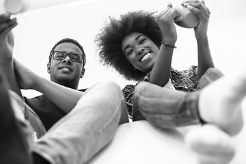 Image showing couple having break during moving to new house