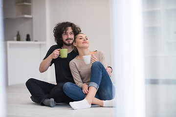 Image showing young couple in their new home