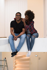 Image showing couple having break during moving to new house