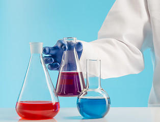 Image showing Experiments in a chemistry lab. conducting an experiment in the laboratory.