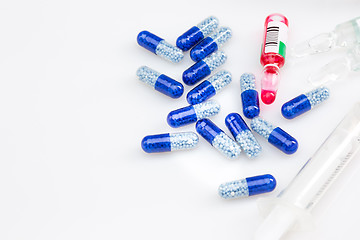 Image showing Blue capsules and pills background