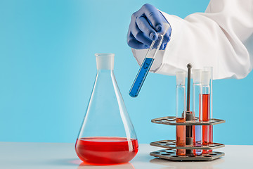 Image showing Experiments in a chemistry lab. conducting an experiment in the laboratory.