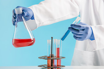 Image showing Experiments in a chemistry lab. conducting an experiment in the laboratory.