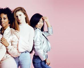 Image showing different nation girls with diversuty in skin, hair. Asian, scandinavian, african american cheerful emotional posing on pink background, woman day celebration, lifestyle people concept 