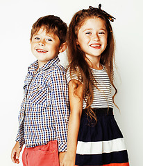 Image showing little cute boy and girl hugging playing on white background, ha