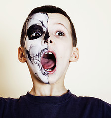 Image showing little cute boy with facepaint like skeleton to celebrate halloween, lifestyle people concept, children on holiday 