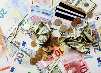 Image showing Cash on table isolated: dollars, euro, rubl broken money. All in mess, global crisis concept