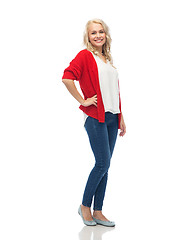 Image showing happy smiling young woman in red cardigan