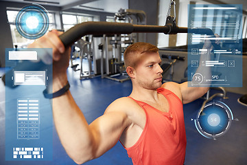 Image showing man flexing muscles on cable machine gym