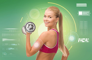 Image showing happy sporty woman with dumbbell flexing biceps
