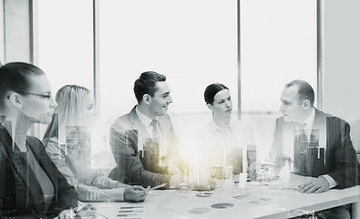 Image showing smiling business team at office meeting