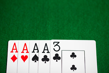 Image showing poker hand of playing cards on green casino cloth